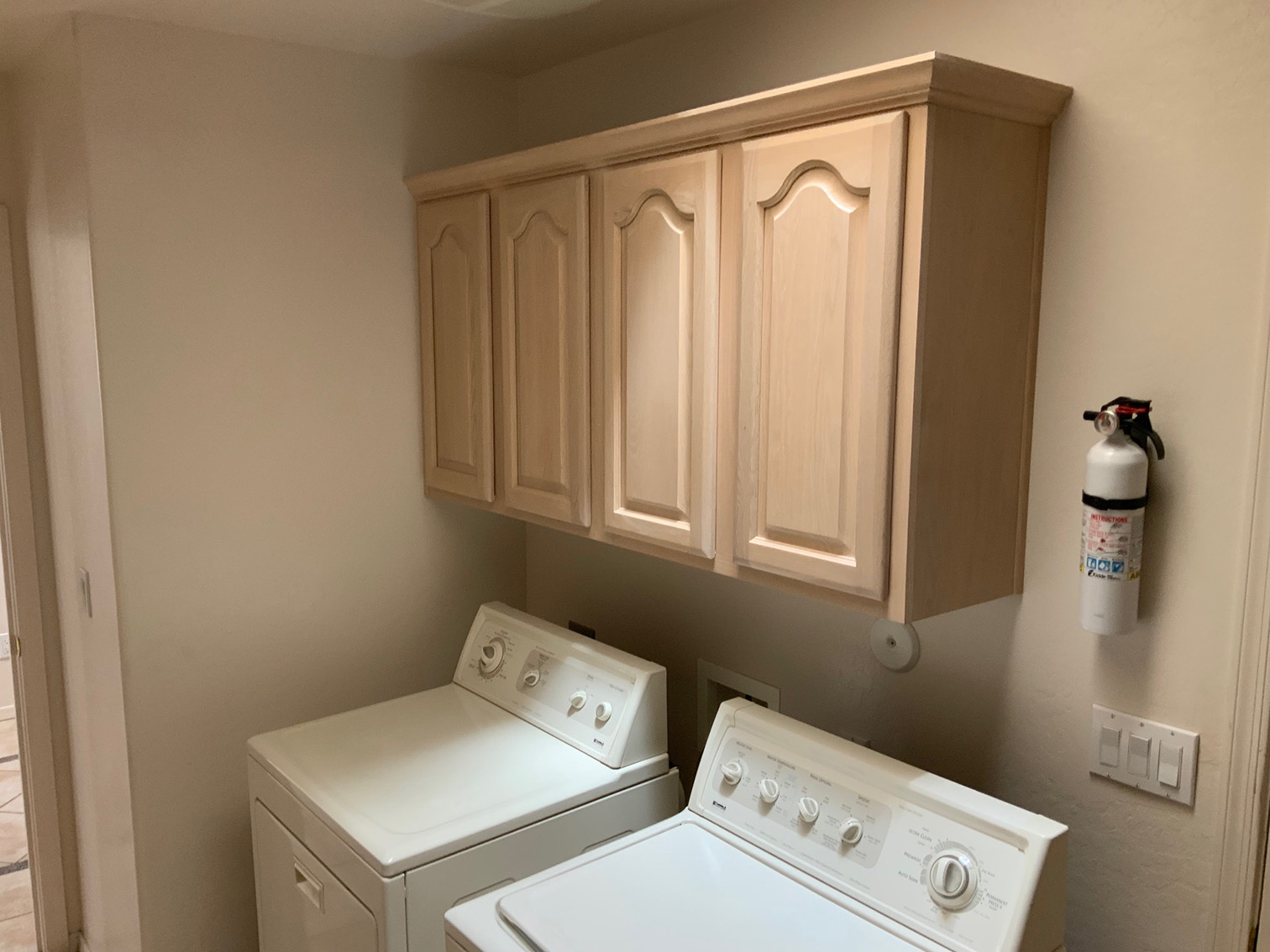 Laundry room cabinet reface before